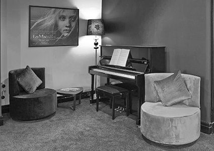 view of the foyer with a piano