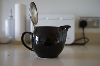 teapot with toaster behind